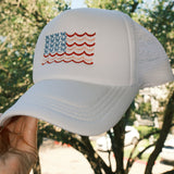 Coquette Bow American Flag embroidered on white trucker hat side view