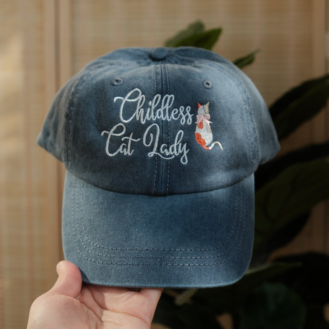 Childless Cat Lady in a Vintage Blue Dad hat from the front